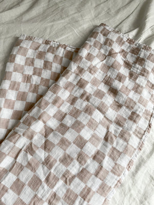Tan checkered swaddle